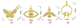 Macro detail of 18K gold plated charms with white zircon inlay for DIY jewelry making