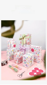 Detail view of birthday gift wrap set with colorful patterns, cotton ropes and stickers