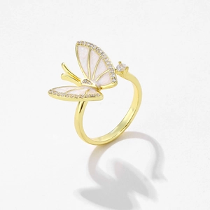 Exquisite gold butterfly ring with white enamel wings and sparkling zircon accents