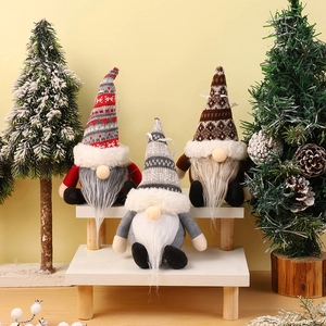Three plush Christmas gnomes with knitted hats for festive tree and home decoration