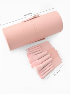 Peach pink makeup brush set in a matching leather storage case with size dimensions