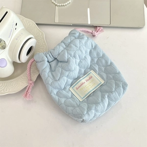 Detail of light blue heart quilted drawstring pouch for camera and small gadgets