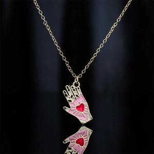 Unique 18K gold plated hand pendant necklace with red heart and pink enamel detail