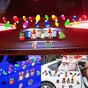 Detail of magnetic Christmas bulb and gnome car stickers with Merry Christmas text