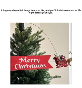 Close-up of Merry Christmas banner with Santa sleigh on rotating tree topper