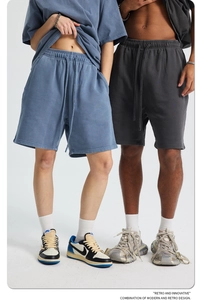 Detail of drawstring waist and side pockets on heavy cotton vintage washed shorts