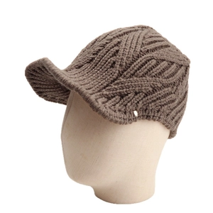 Winter knitted peak cap in dark brown with thick cable knit texture and metal button detail