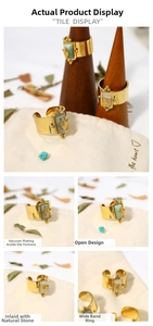 Detail view of gold stainless steel star ring with natural stone inlay and adjustable band