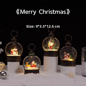 Close-up of four festive Christmas lanterns featuring snowman and reindeer inside