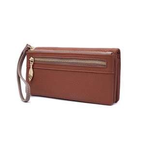 Detail view of brown leather long wallet featuring triple zippers and gold leaf pulls