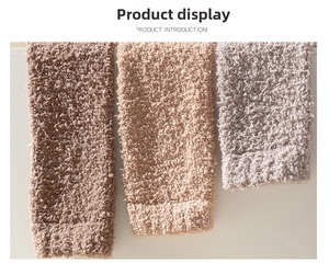Detailed texture of thick coral fleece leg warmers in brown, beige, and mauve colors