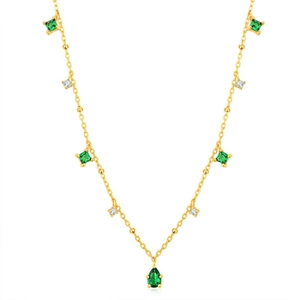 Detail of gold necklace with green emerald-cut stones and a teardrop pendant