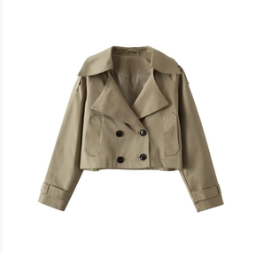Detail of short double-breasted khaki trench coat with lapels and cuff straps on white background