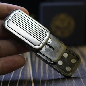 Detail of metal magnetic slider EDC toy with silver and brass finish and magnet points