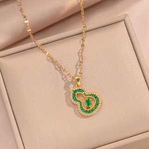 18K gold plated hollow gourd necklace with green zircon inlay on silk background