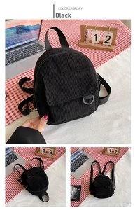Detail of black corduroy mini backpack with front flap pocket and adjustable straps