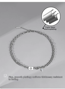 Detail of silver Cancer constellation necklace with triple-layer electroplating and blue zircon