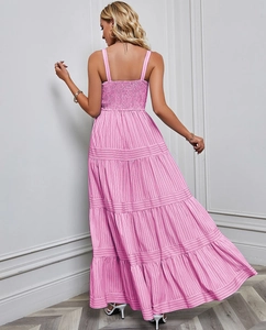Detail of smocked elastic back and pink striped fabric on a summer maxi dress