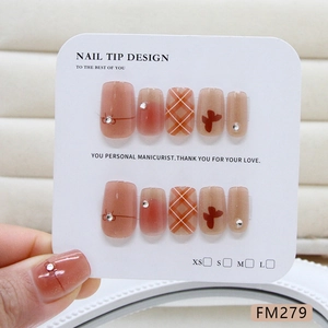 Cat eye bow press-on nails with glitter rhinestones and checkered patterns in pink