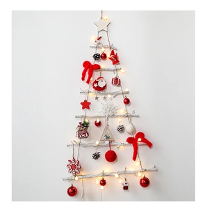 Detail of wooden wall-mounted Christmas tree with red bows, LED lights, and ornaments
