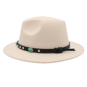 Detail of beige fedora with black leather band featuring turquoise and silver studs