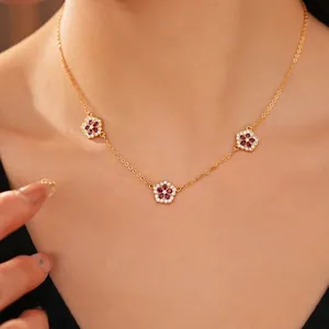 Elegant 18K gold plated necklace with three floral pendants and red zircon stones
