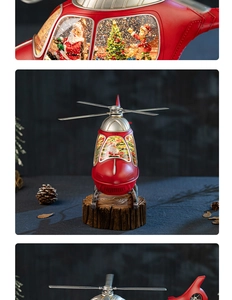 Macro view showing internal Santa and Christmas tree details of the helicopter snow globe