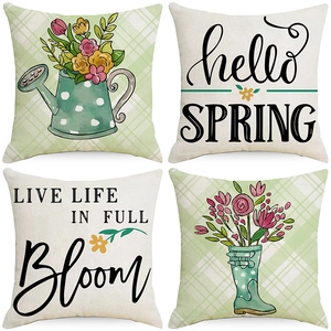 Set of four floral linen pillow covers with hello SPRING text and garden motifs