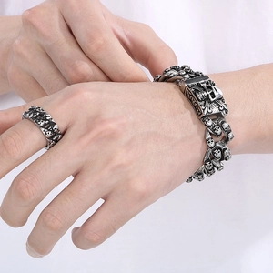 Retro stainless steel skull bracelet and ring set with a vintage silver finish for men