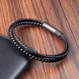 Detail view of multi-layer leather braid bracelet with matte beads and magnetic clasp