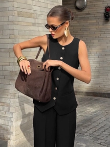 Women's black suit vest and wide-leg trousers set with gold buttons and high-waist fit