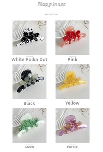Detail view of colorful acetate hair claws set with floral rhinestones in six shades