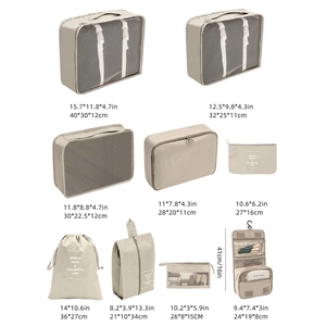 Detail view of 9-piece beige travel organizer set with precise size dimensions in cm and inches