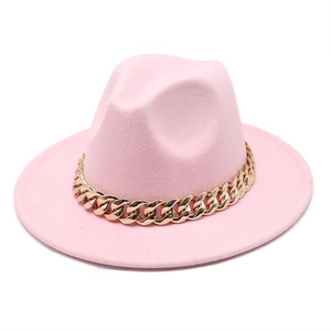 Pink wool fedora hat with a chunky gold chain band accessory on a white background