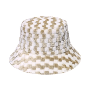 Close-up of beige checkered faux fur bucket hat showing soft plush texture and pattern