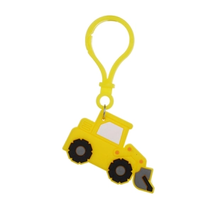 Detailed close-up of yellow cartoon tractor keychain with black tires and plastic hook