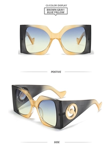 Detail view of square oversized sunglasses with brown-gray and blue-yellow gradient lenses
