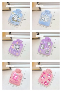 Detailed grid of 500ml mini hot water bottles in soft plush with cute cartoon patterns