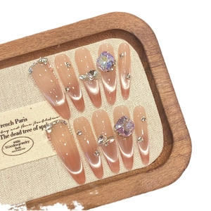 Pink cat-eye gradient almond press-on nails with luxury rhinestones and purple crystals