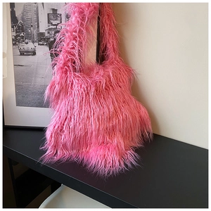 Close-up of pink faux fur texture on a trendy plush shoulder bag for women