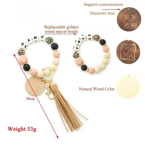 Detail of MAMA silicone bead keychain featuring leopard beads and custom wood pendant