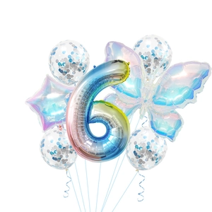 Detail view of rainbow gradient butterfly and number 6 foil balloons with confetti set