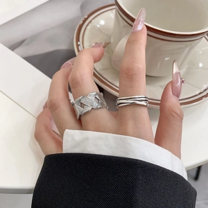 Irregular S925 sterling silver woven and multi-layered open rings on female hand