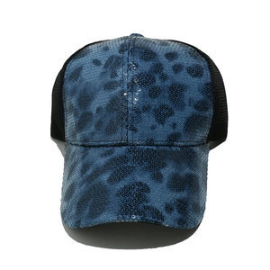 Detailed view of blue leopard print sequins and breathable black mesh on baseball cap