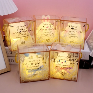 Cartoon animal night light gift boxes with glowing rabbit and bear in warm yellow light