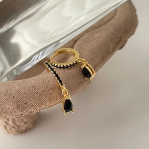 Detail view of 925 silver gold earrings with black zircon stones and teardrop charms