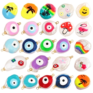 Handmade Evil Eye and mixed charm pendants with natural pearls and colorful enamel