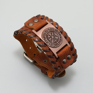 Detail of Viking Vegvisir compass engraving on brown woven leather strap bracelet