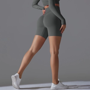 Detail view of charcoal gray seamless high-waist yoga shorts with scrunch butt lifting texture