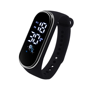 Detail of M4 kids digital watch with black silicone strap and astronaut LED screen